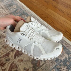 On Running White and Tan Shoes